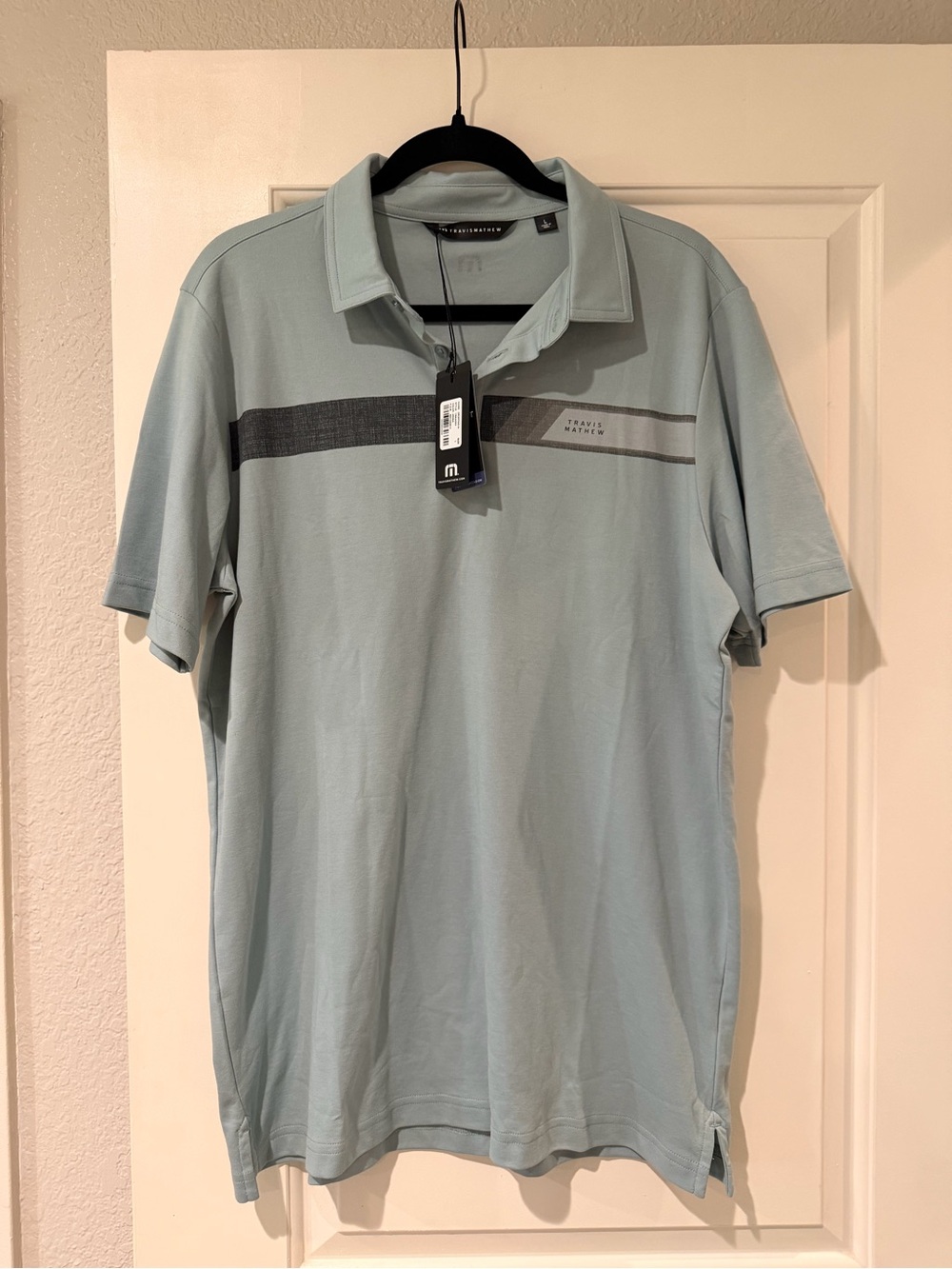 Travis Mathew Light Blue Polo with Stripe